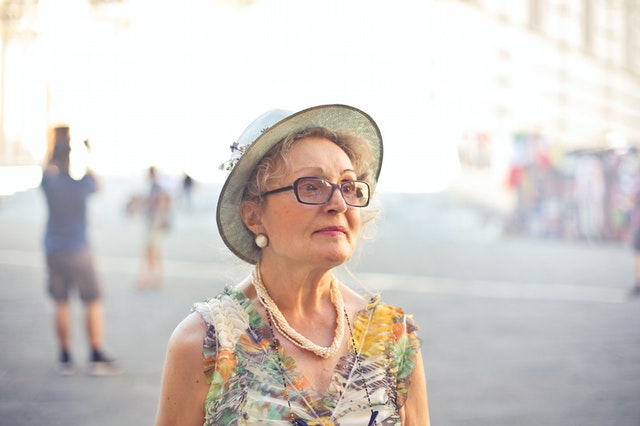 elderly woman in glasses